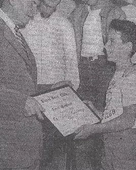 John receiving reward as a young boy at the Boys and Girls Club
