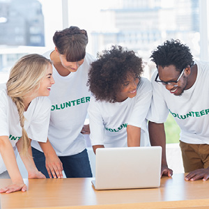 Volunteers around a computer
