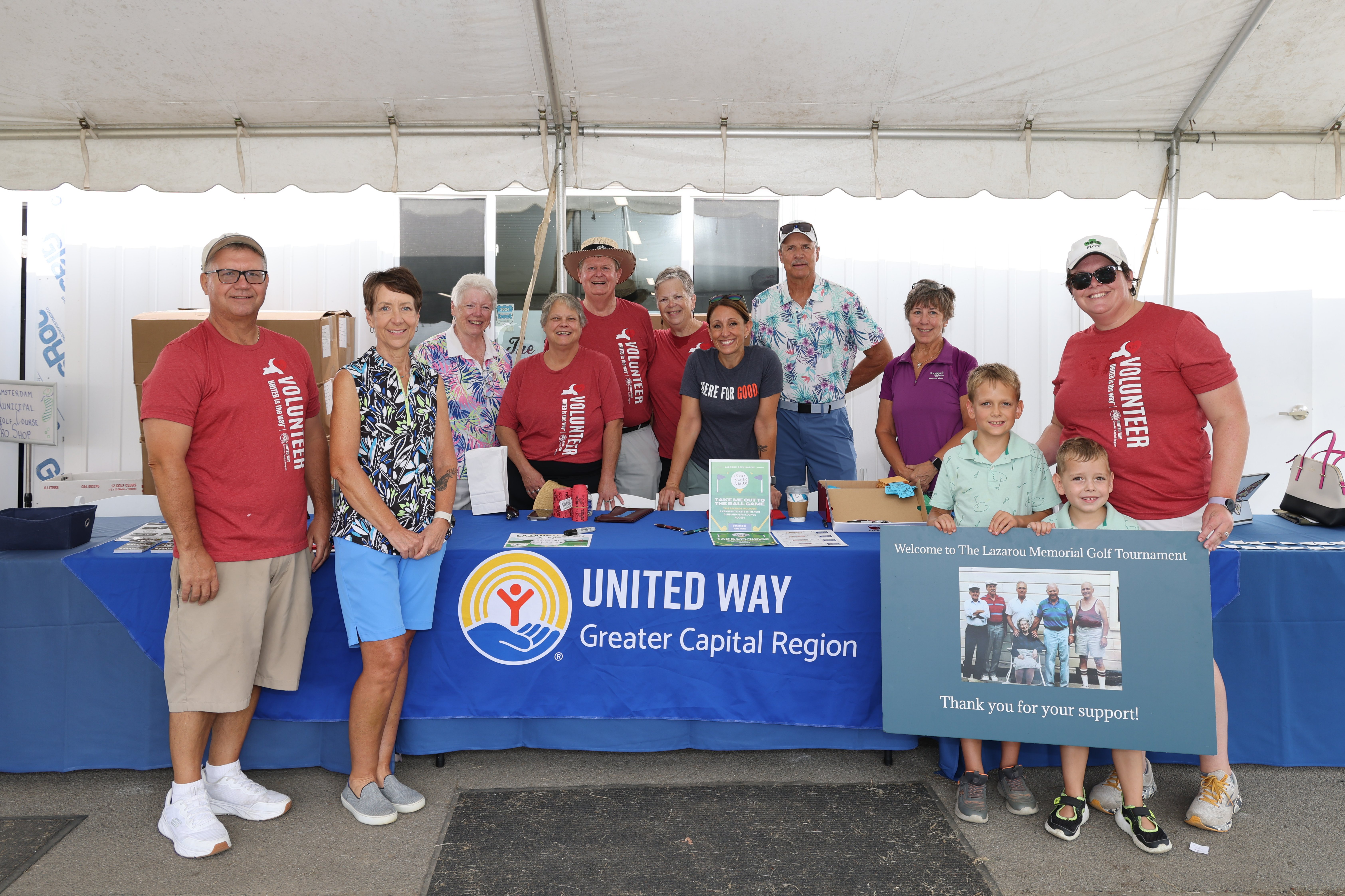 Staff and Volunteers around registration table