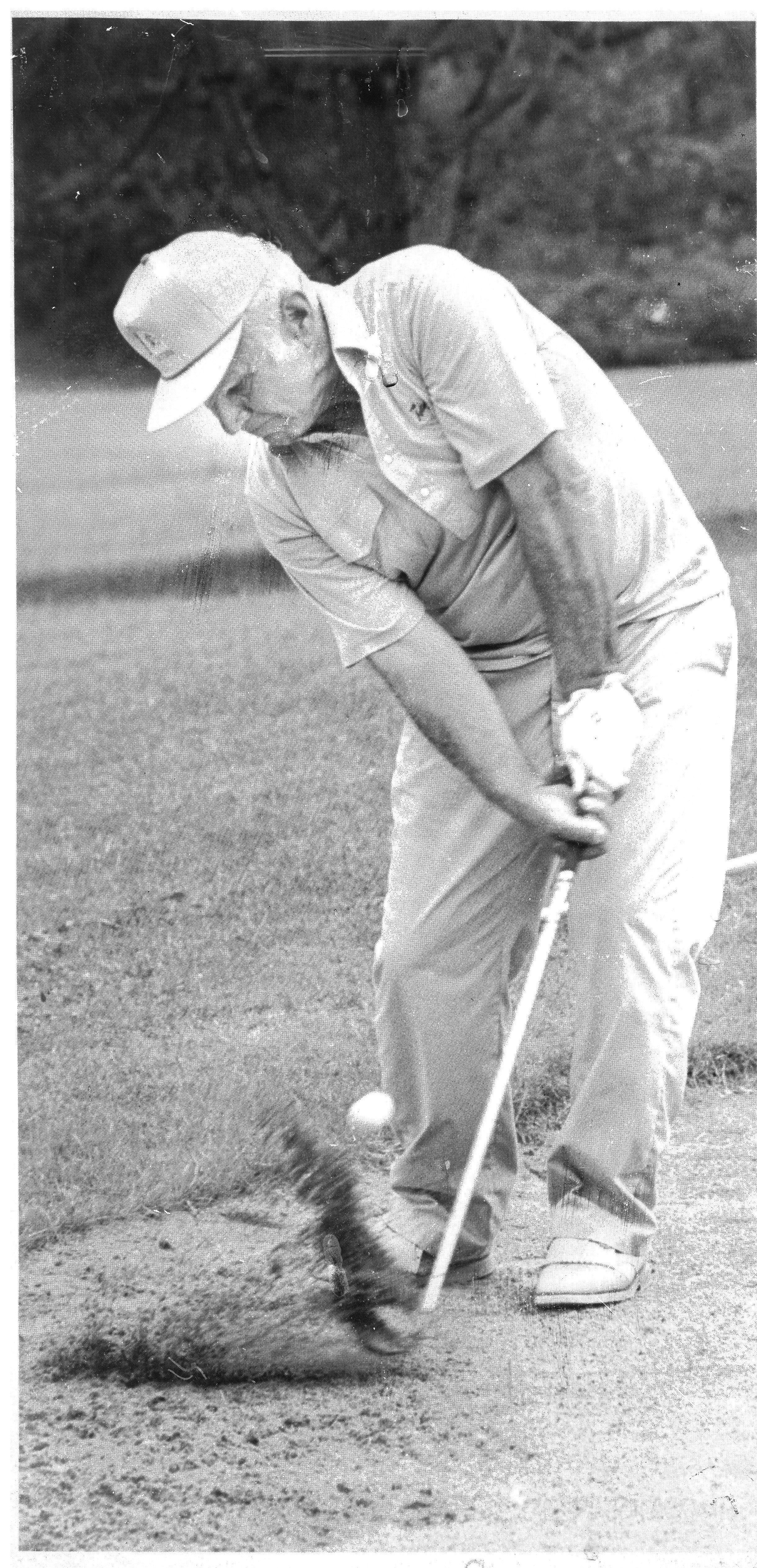 Aristotle Lazarou swinging a golf club