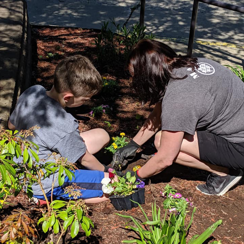 Adult and child gardening