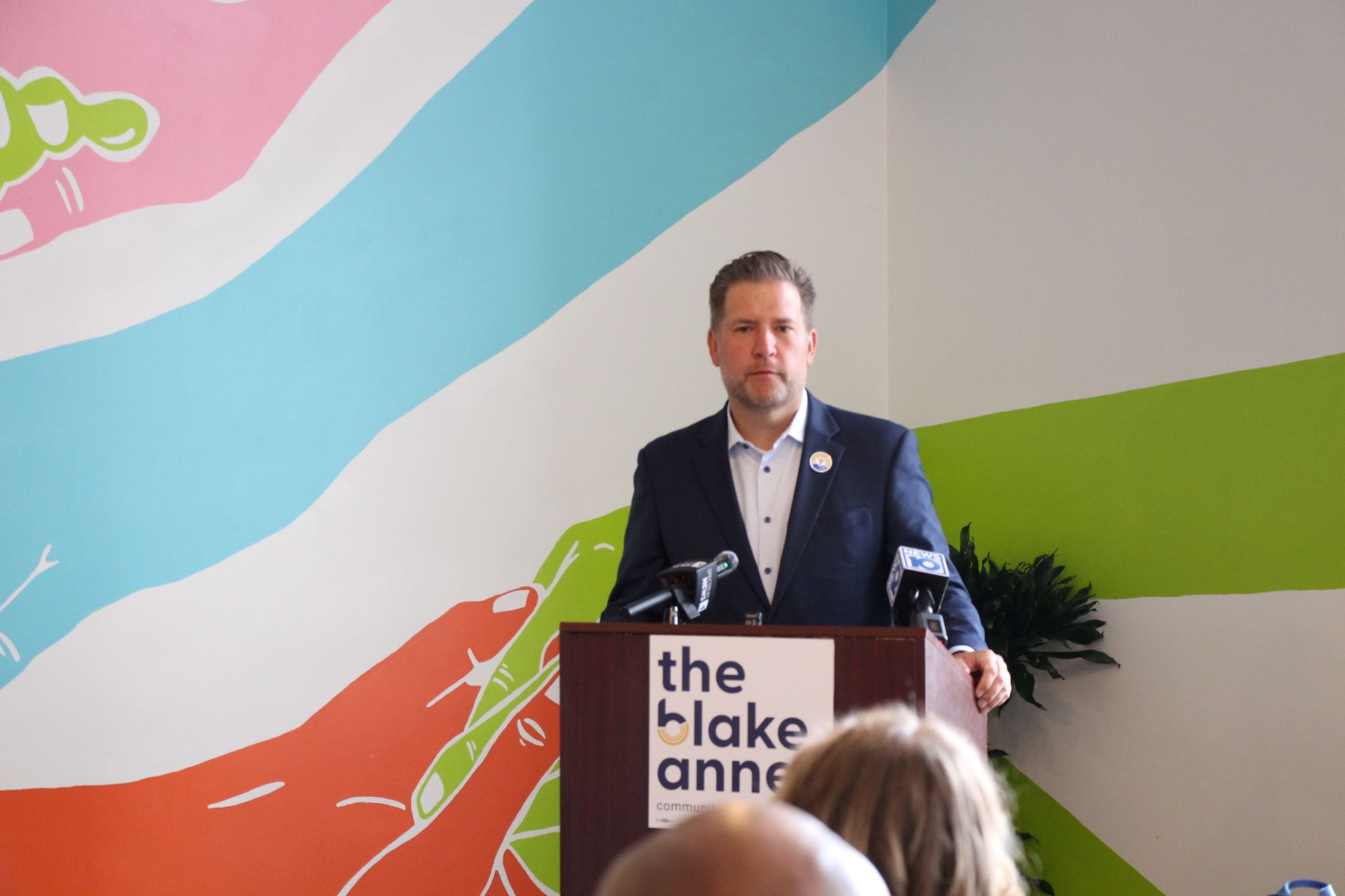 Peter speaking at Podium