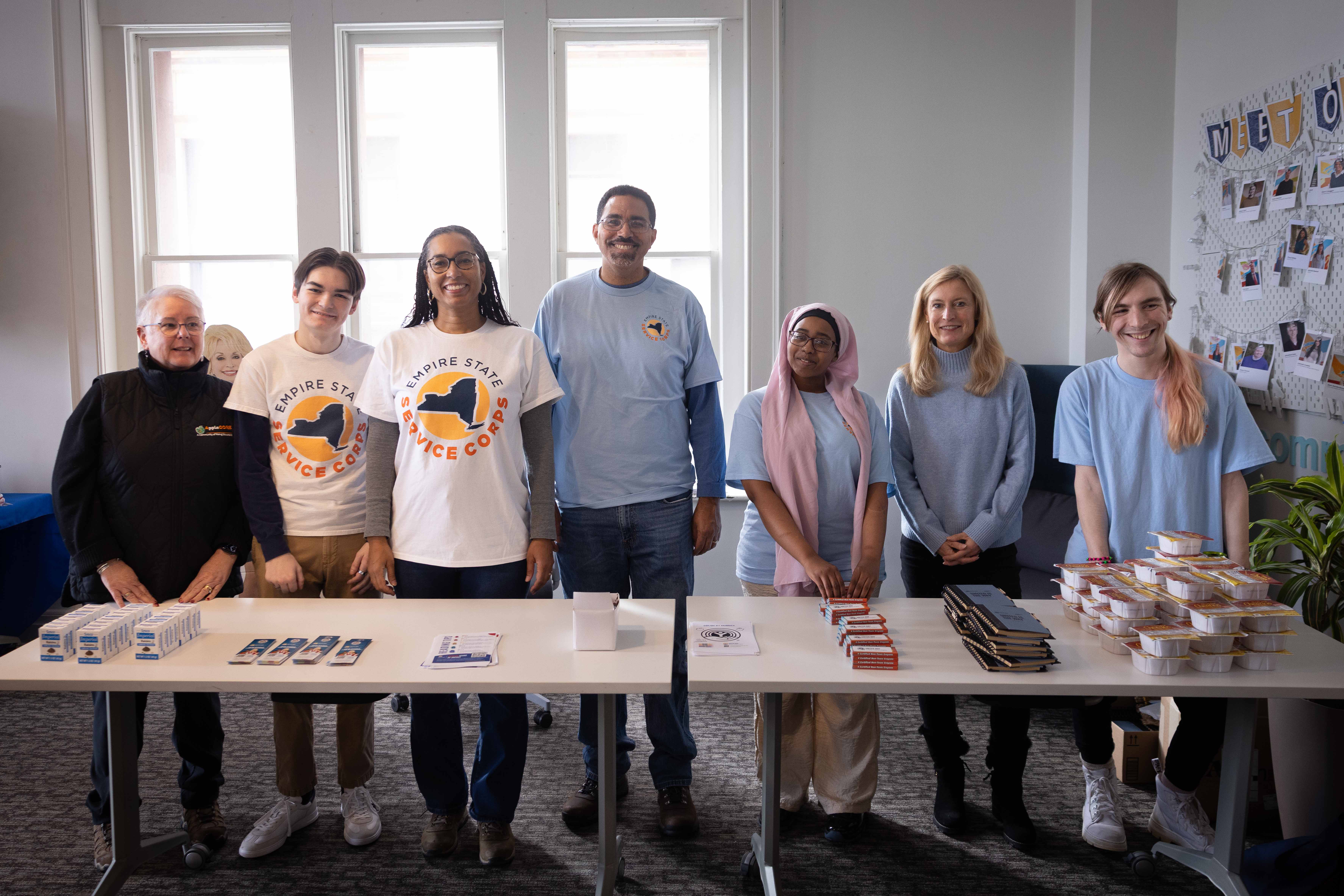 Volunteers in line ready to stuff bags
