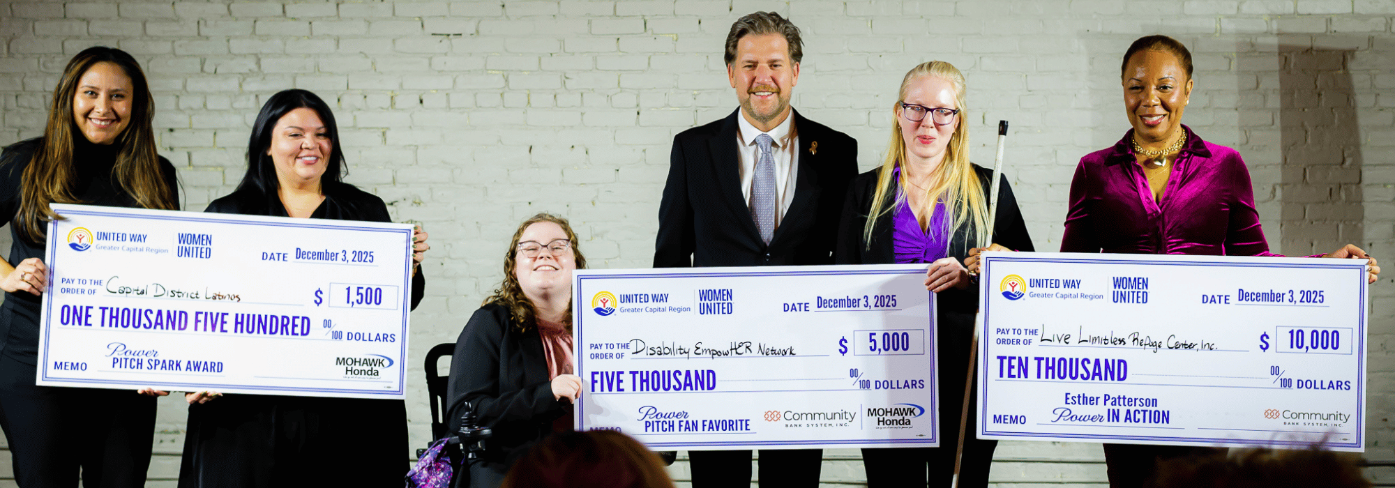 Power Pitch winners holding large checks