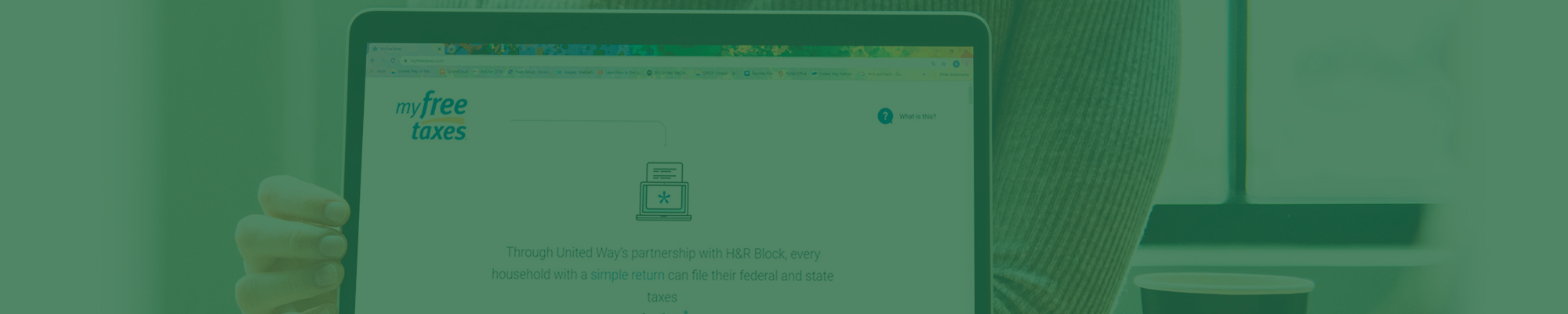 Girl with laptop displaying MyFreeTaxes