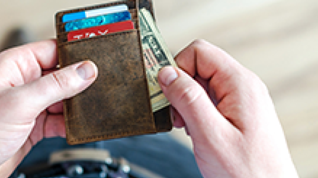 Man pulling money out of wallet