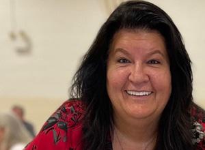 woman smiling in red shirt