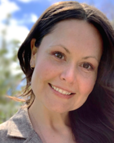 Marcia smiling with head tipped